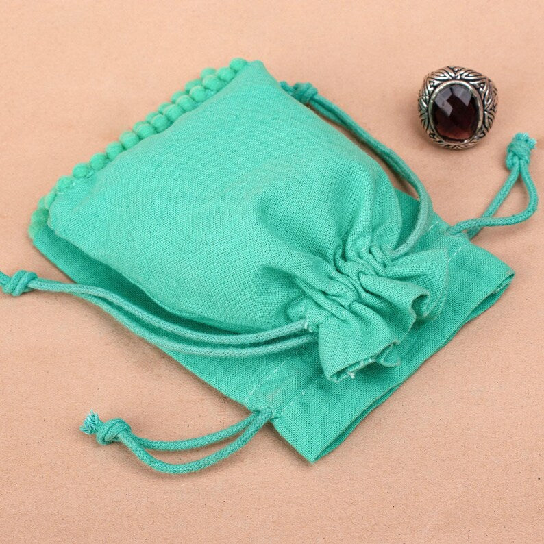100 Custom Turquoise Designer Pouches Delightful and Personalized bottom pom poms