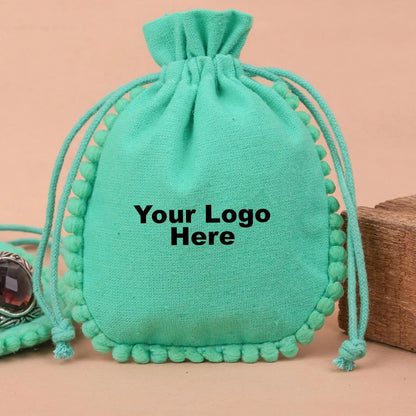100 Vibrant Teal Designer Pouch: Accented with soft Pom Poms