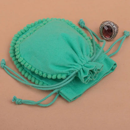 100 Vibrant Teal Designer Pouch: Accented with soft Pom Poms