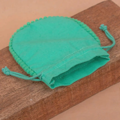 100 Vibrant Teal Designer Pouch: Accented with soft Pom Poms