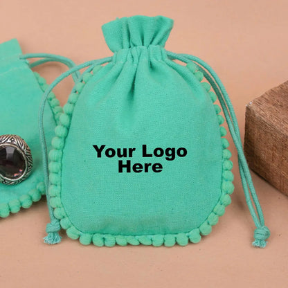 100 Vibrant Teal Designer Pouch: Accented with soft Pom Poms